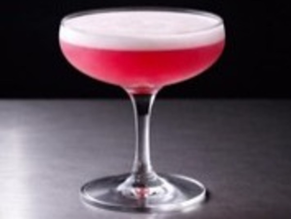 Clover Club non-alcoholic coupe with bright pink raspberry foam
