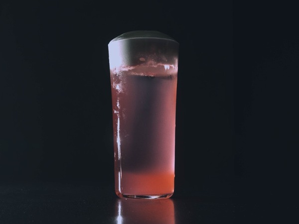 Coco Bliss non-alcoholic cocktail — pineapple coconut and lime in a tropical styled glass